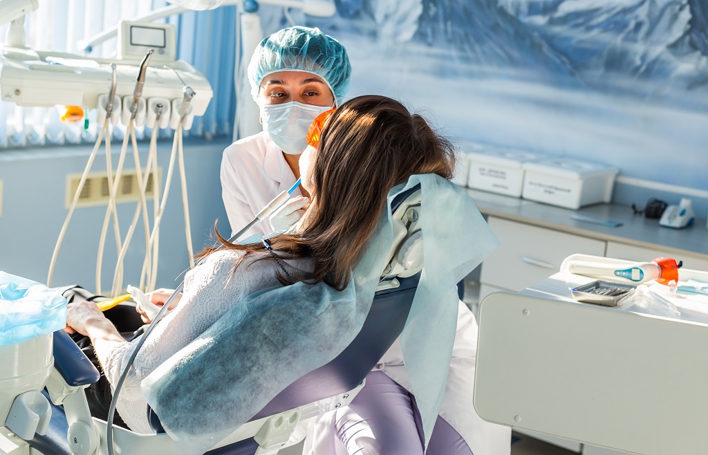 Young woman getting dental treatment.