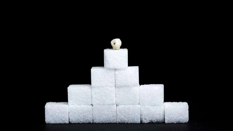 People who regularly consume sugar have a higher risk of developing dental caries